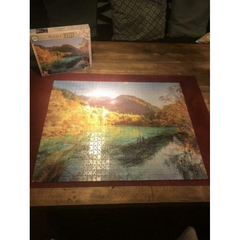 7 x 1000 stukjes puzzel en 1 x 2000 stukjes